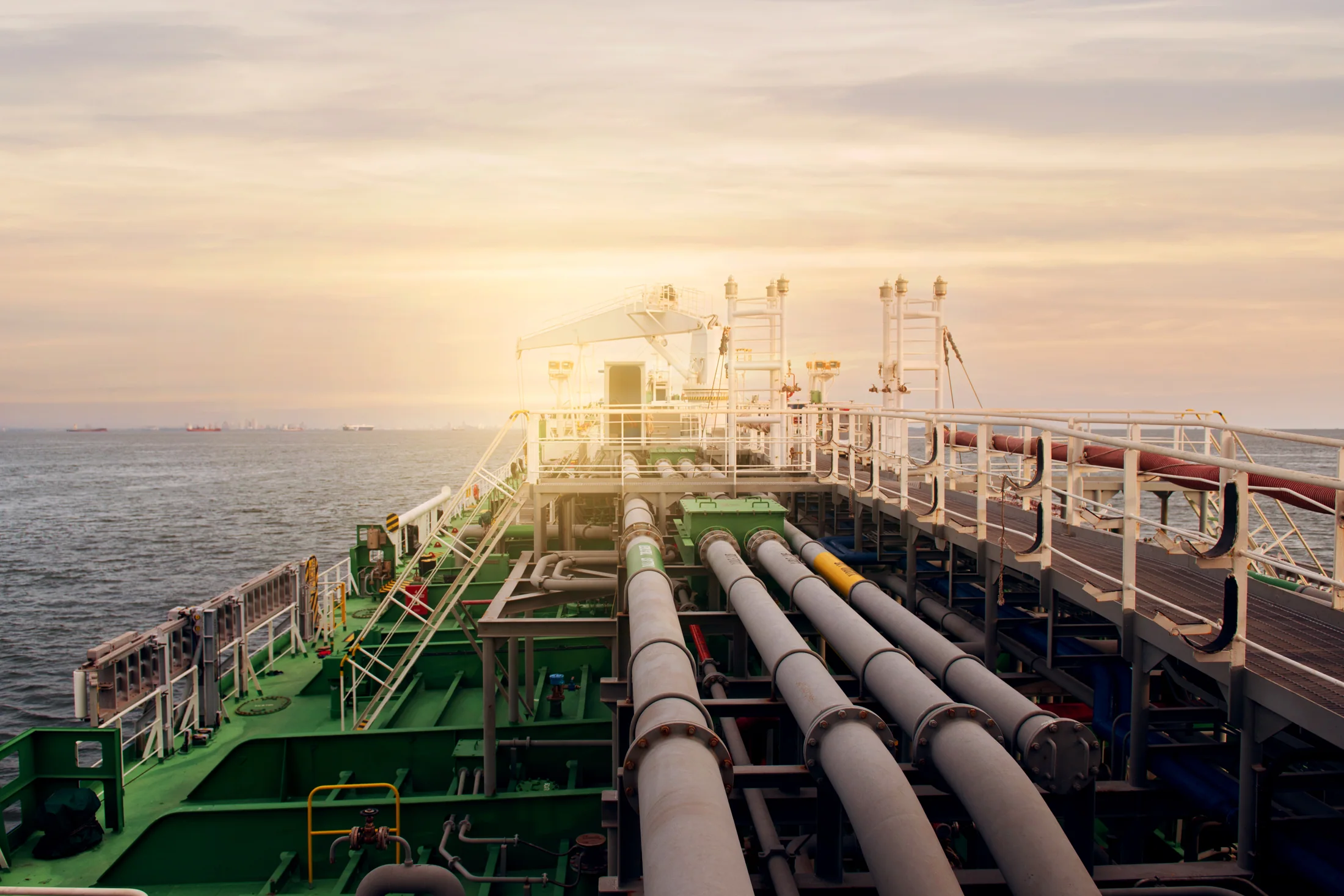 Deck pipework and fittings on a vessel at sea.