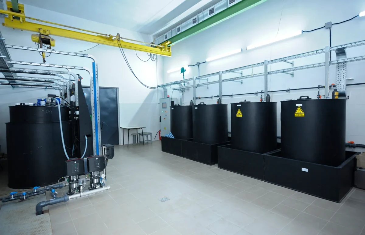 Chemical dosing tanks and pipework used in water disinfection.